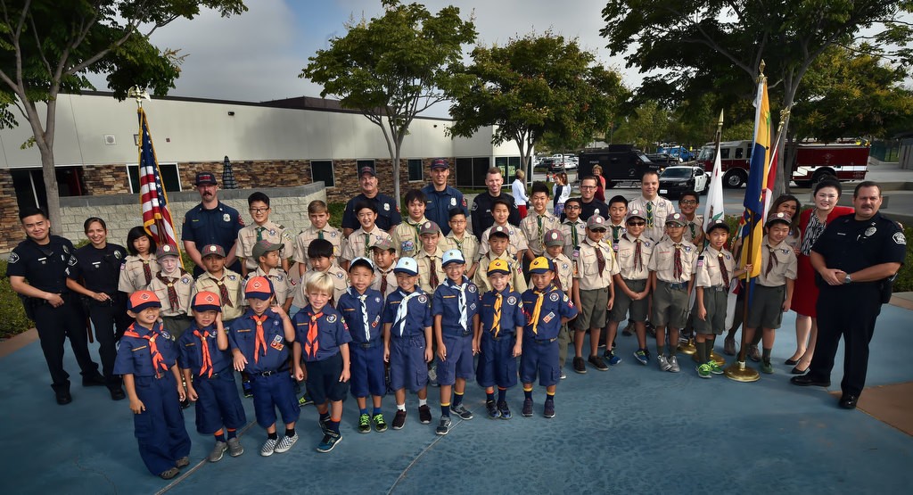 Boy Scouts and Cub Scouts from troop 1238 stand with Fullerton police and fire after a 9-11 assembly at Fisler Elementary School. Photo by Steven Georges/Behind the Badge OC