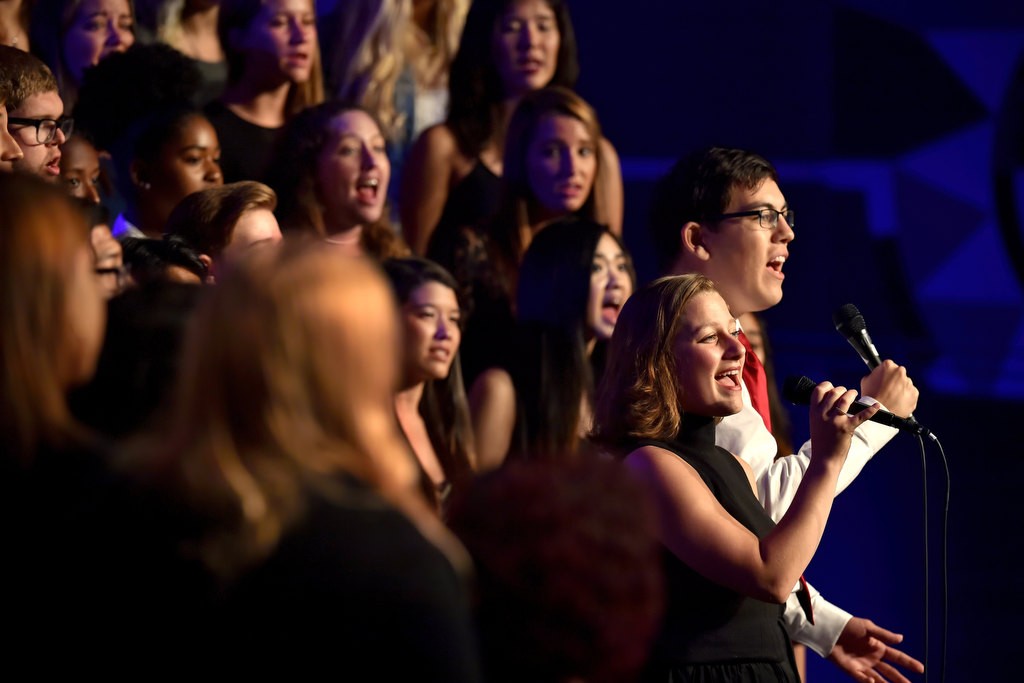 Hannah Efsits, left, and Aaron Leppke sing with the Vanguard University Concert Choir during Anaheim’s 9-11 remembrance ceremony at the City National Grove of Anaheim. Photo by Steven Georges/Behind the Badge OC