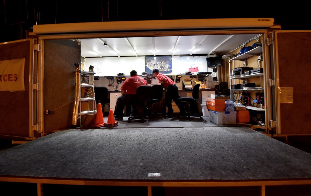 Anaheim Fire & Rescue’s CERT/RACES volunteers Daniel Jacobsen, left, and Norman Todd setup the communication radios inside Anaheim’s Volunteer Communication Unit, a portable trailer complete with its own optional power generator, for a drill at Anaheim’s EOC (Emergency Operations Center). Photo by Steven Georges/Behind the Badge OC