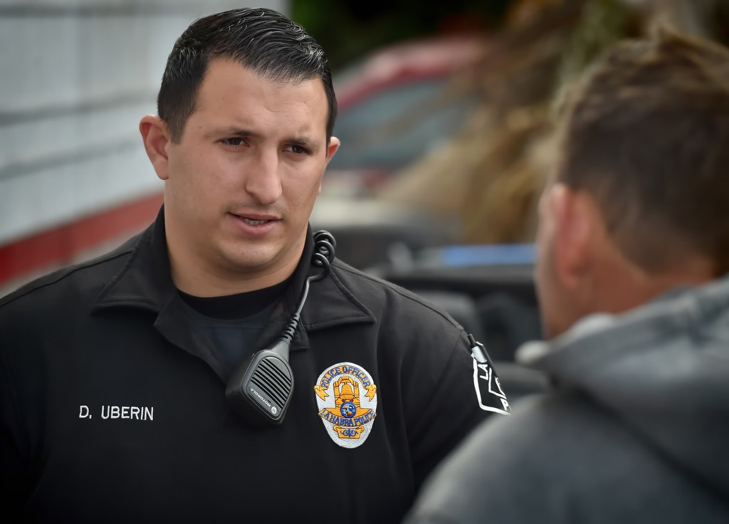 La Habra PD Officer Daniel Uberin of the homeless outreach program talks to a homeless man who had been assaulted by a man in a neighboring apartment complex.  Photo by Steven Georges/Behind the Badge OC