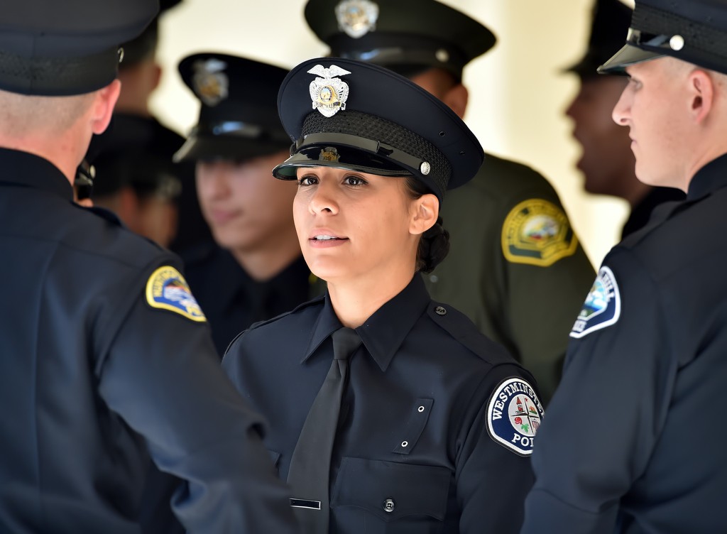 Westminster PD recruit Frani Echavarria talks with her classmates before the start of Golden West College Criminal Justice Training Center's graduation ceremony at Orange Coast College. Photo by Steven Georges/Behind the Badge OC