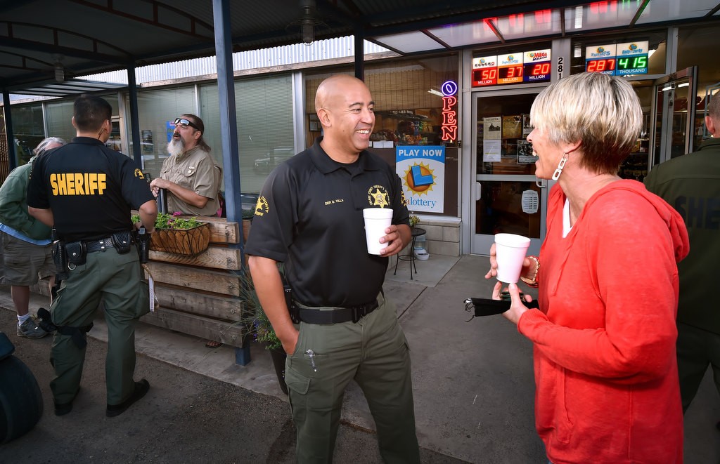 OC Sheriff Dep. Dan Villa talks to Marion Schuller, resident of Silverado Canyon for 8-years and director of Canyon Watch, during the OCSDÕs Coffee with a Cop at Silverado Canyon Market. Photo by Steven Georges/Behind the Badge OC