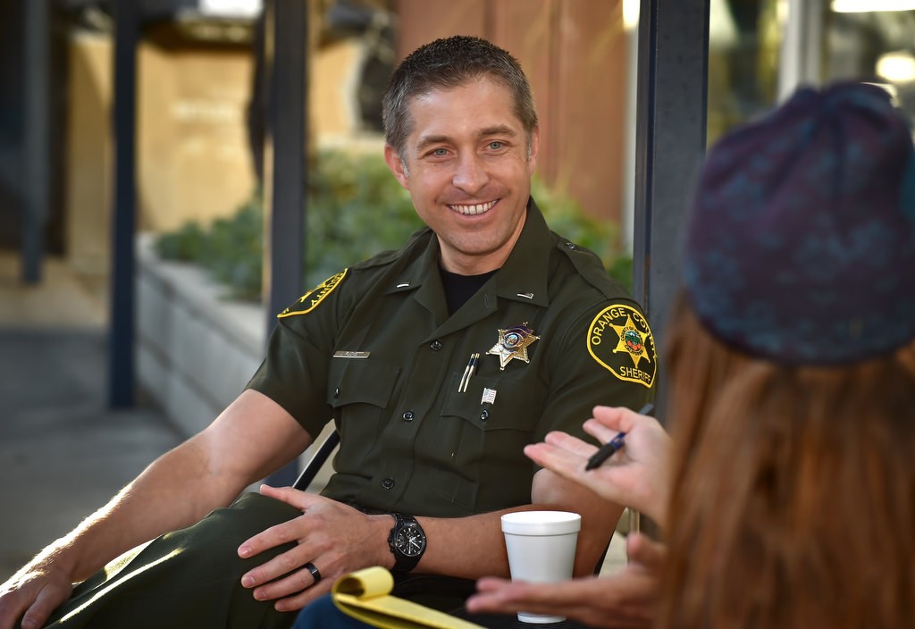 OC Sheriff Lt. Jeff Puckett talks to local residents during the OCSDÕs Coffee with a Cop at Silverado Canyon Market. Photo by Steven Georges/Behind the Badge OC