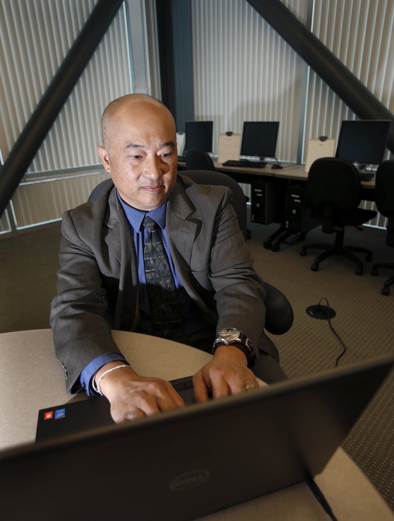 Orange County Sheriff's Department Scott Yuen works investigating cybercrime. Photo by Christine Cotter