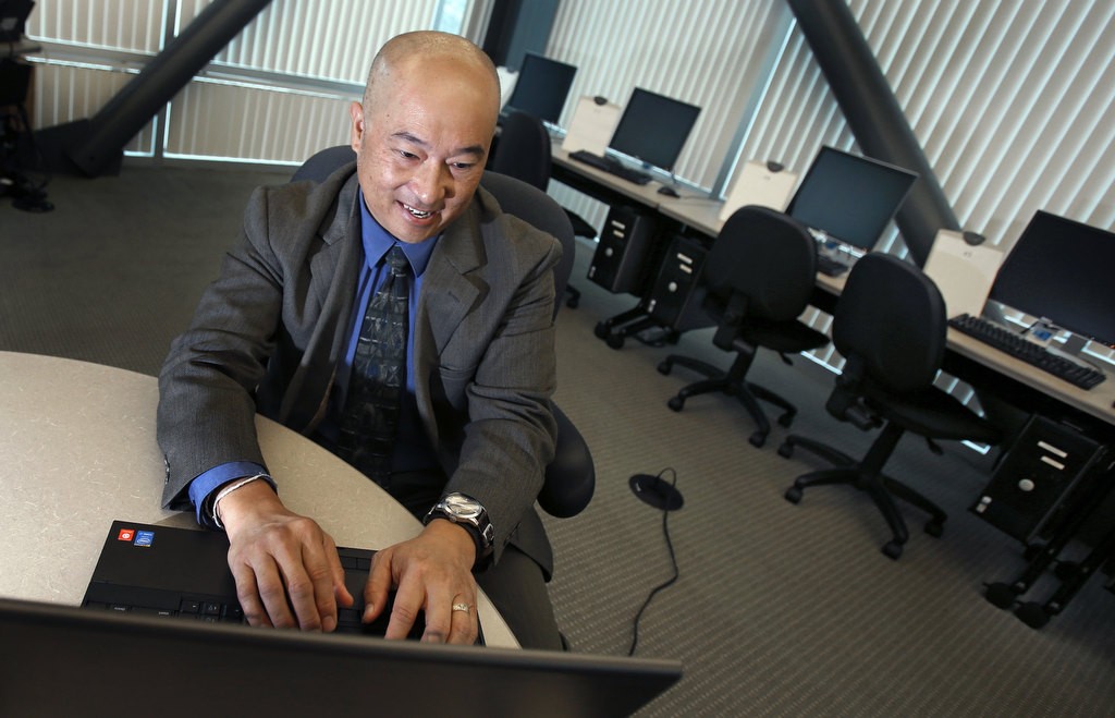 Orange County Sheriff's Department Scott Yuen works investigating cybercrime. Photo by Christine Cotter