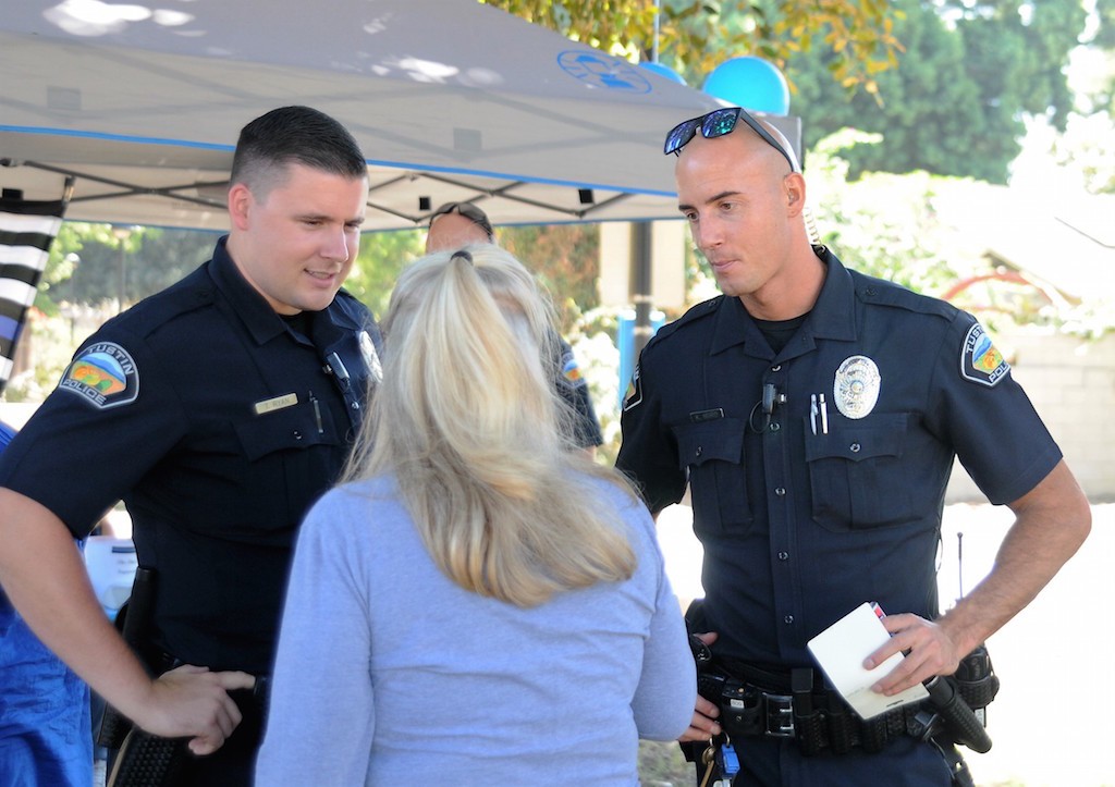 Tustin Police officers, Taylor Ryan, left, and Kyle Howard, were among several officers on hand for a meet-and-greet at Centennial Park, organized by Valerie Mann, founder of the Facebook group, The Thin Blue Line Supporters. 