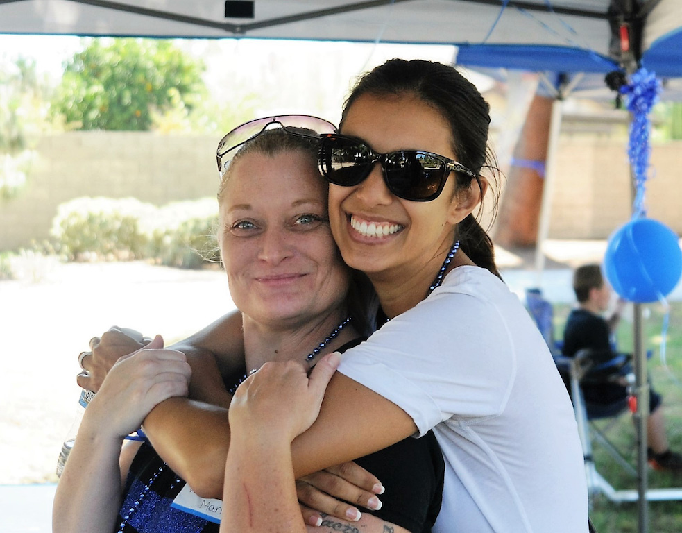  Valerie Mann, left, founder of the Facebook page, The Thin Blue Line Supporters, posed for a photo with Tustin Police Officer Michelle Jankowski during meet-and-greet at Centennial Park that was organized by Mann. 