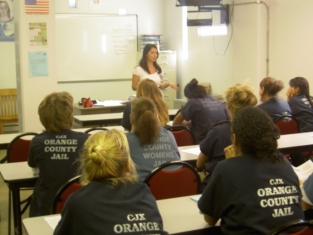 Volunteer teachers lead a variety of classes to help prepare inmates for life on the outside. Education courses, food certification classes and parenting groups are among the most popular program in Orange County's jails. Photo courtesy OCSD. 
