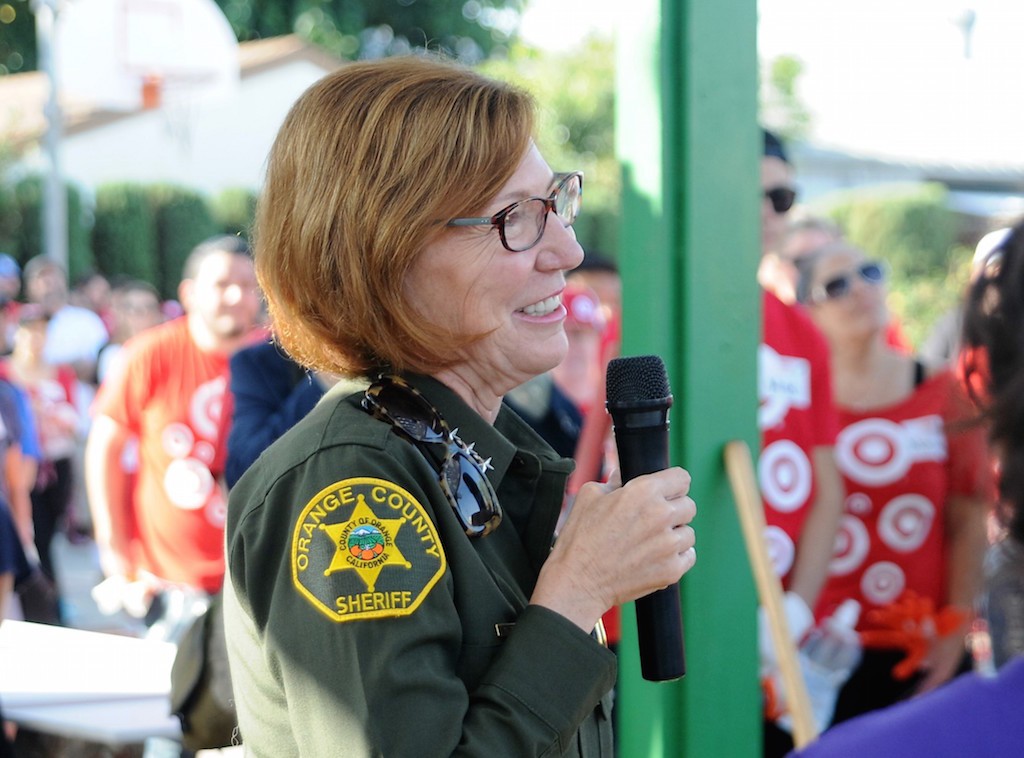 OC Sheriff Sandra Hutchens spoke words of encouragement to volunteers at the playground building project in Anaheim. Photo by Lou Ponsi/Behind the Badge OC