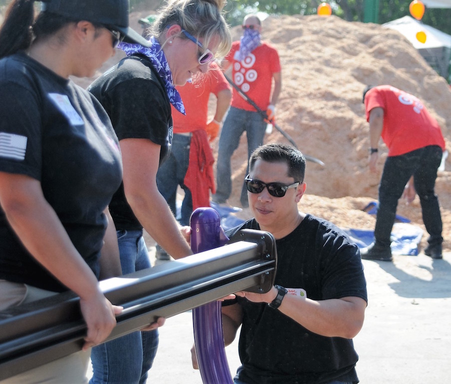 From left, CSA Nadine Martinez and deputies Lindsey Rodgers and Gene Minko construct playground equipment as part of a major playground building volunteer project in Anaheim. Photo by Lou Ponsi/Behind the Badge OC
