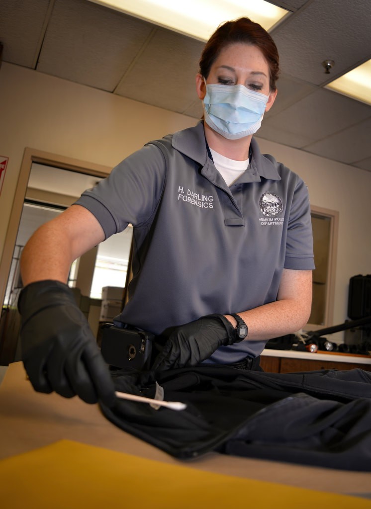 Hannah Darling, forensic specialist for the Anaheim PD, demonstrates a method of retrieving DNA evidence. Photo by Steven Georges/Behind the Badge OC