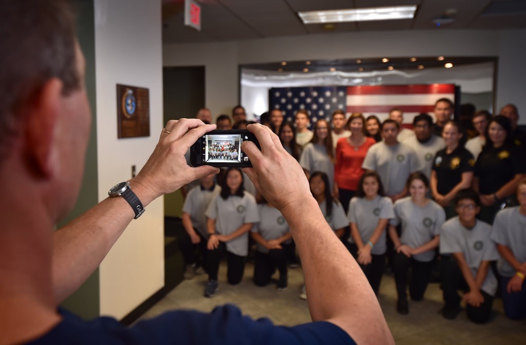 Graduates of the Youth Citizens’ Academy gather for a group photo at Orange County Sheriff's Training Center. Photo by Steven Georges/Behind the Badge OC