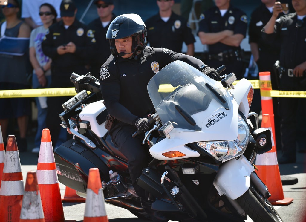 La Habra PD Officer Tam Do competes during the 2016 OCTOA (Orange County Traffic Officers Association) Motor Rodeo at Huntington Beach. Photo by Steven Georges/Behind the Badge OC