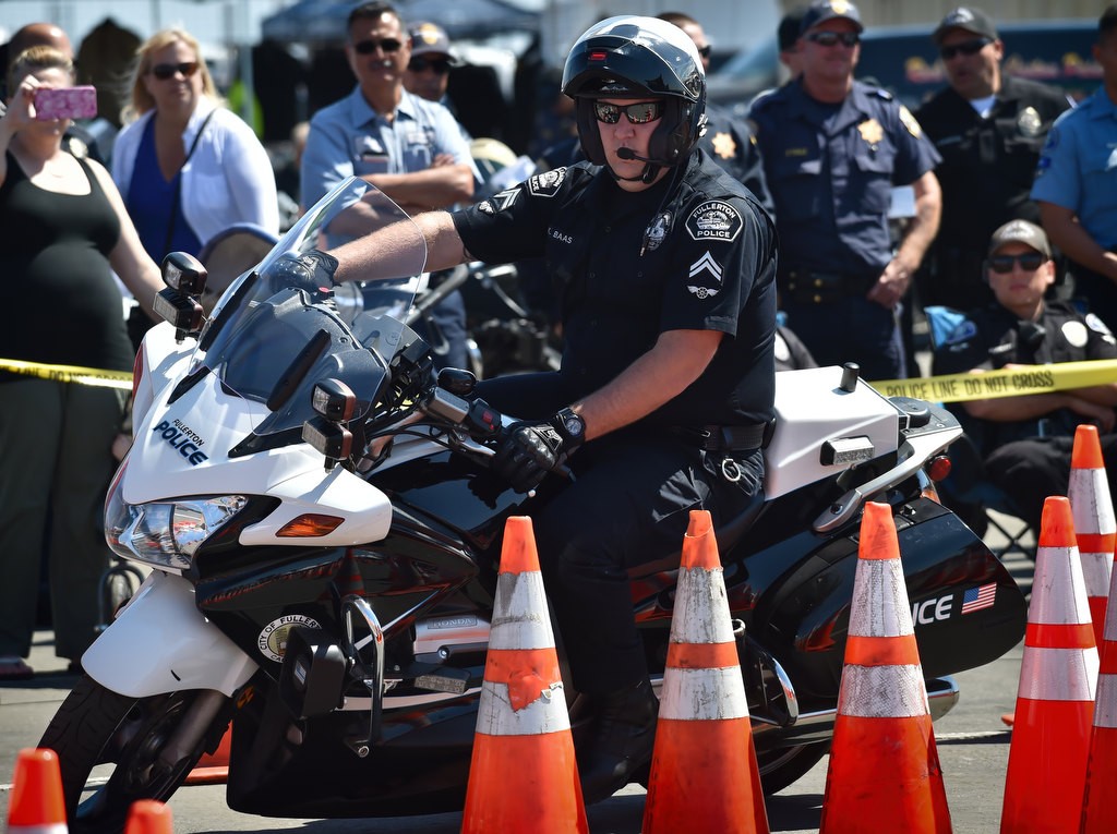 Fullerton PD Motor Officer Kyle Baas competes during the 2016 OCTOA (Orange County Traffic Officers Association) Motor Rodeo at Huntington Beach. Photo by Steven Georges/Behind the Badge OC