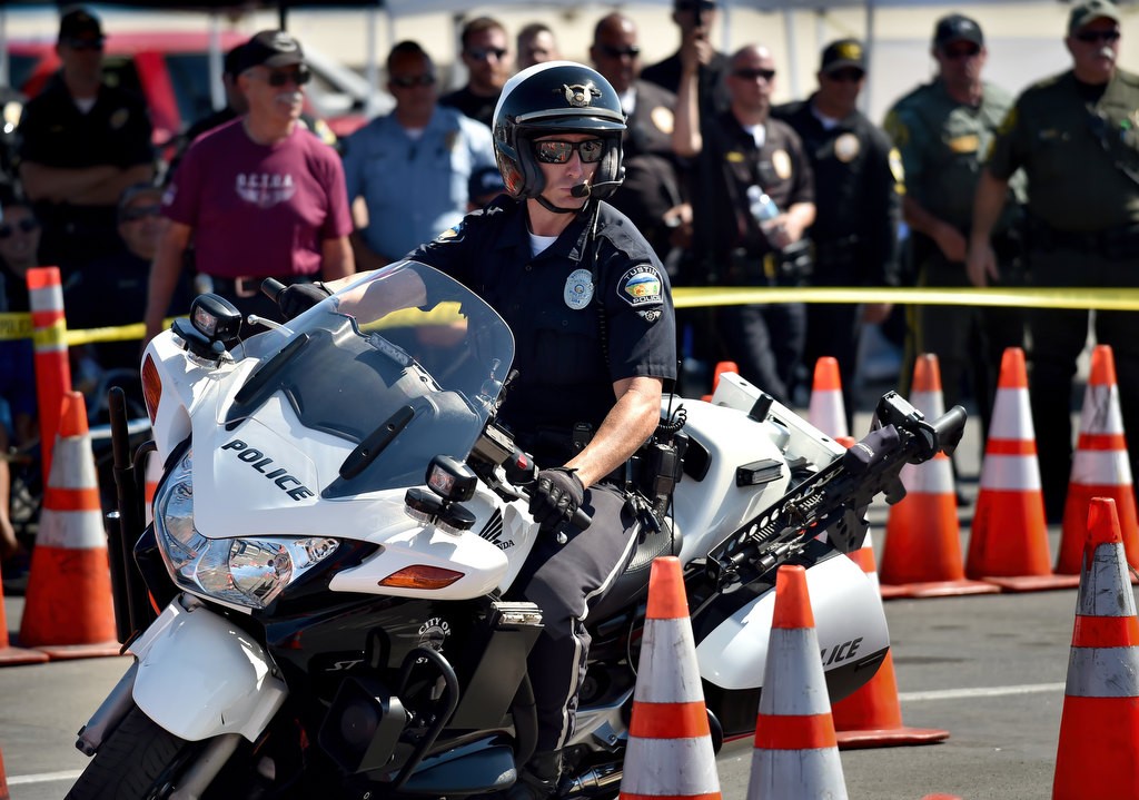 Tustin PD Officer John Hedges competes during the 2016 OCTOA (Orange County Traffic Officers Association) Motor Rodeo at Huntington Beach. Photo by Steven Georges/Behind the Badge OC