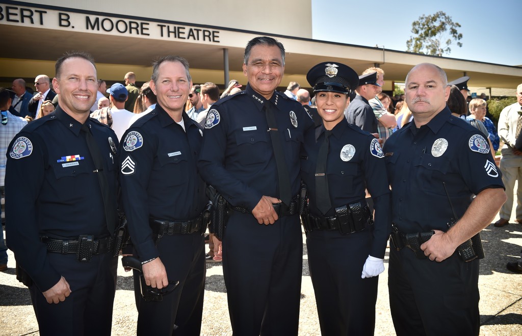 Members of the Westminster PD, Cmdr. Cameron Knauerhaze, left, Sgt. Mark Lauderback, Chief Roy Campos, Officer Frani Echavarria and Sgt. Darrick Vincent at Echavarria’s GWC Criminal Justice Training Center Basic Police Academy graduation ceremony. Photo by Steven Georges/Behind the Badge OC