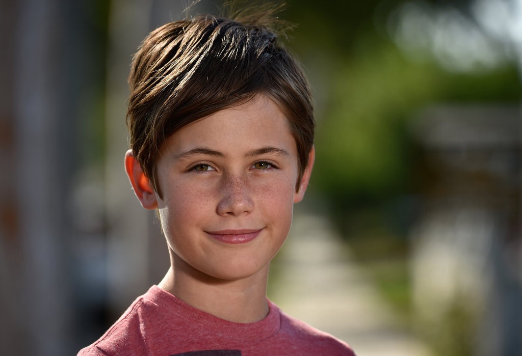 Jude Varieur, 11, of Fullerton, made signs for his street to tell drivers on his street to slow down. Photo by Steven Georges/Behind the Badge OC