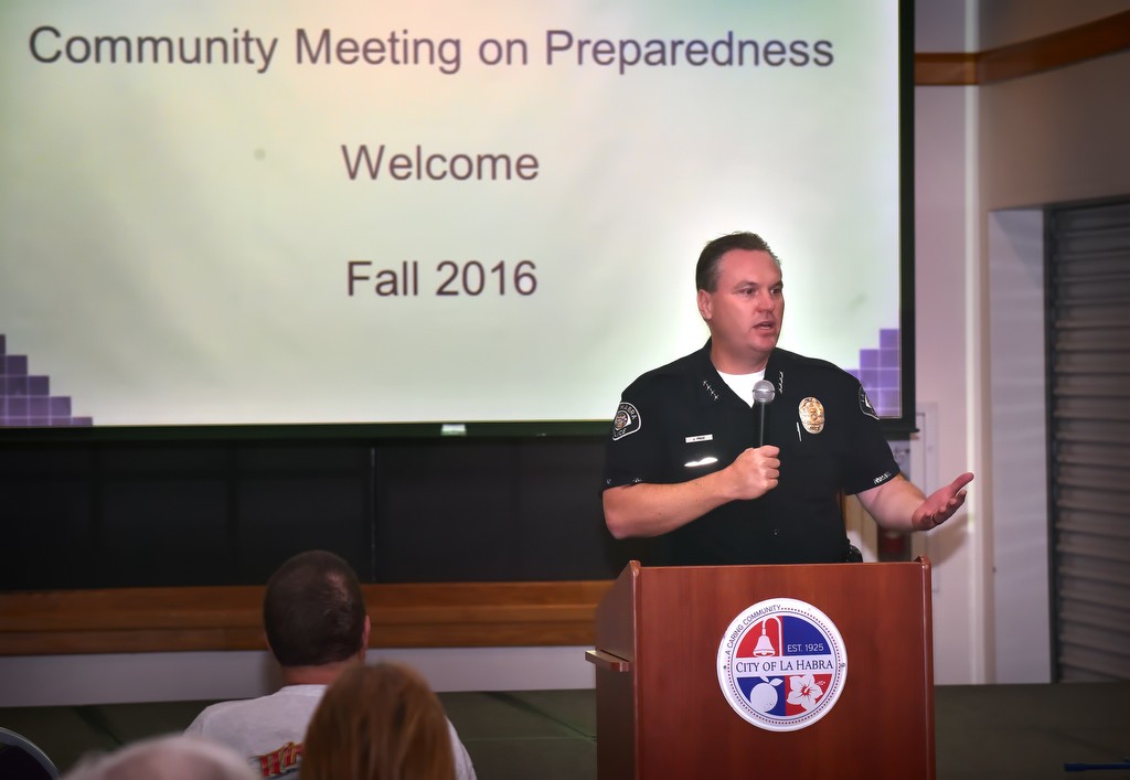 La Habra Police Chief Jerry Price welcomes guests attending an emergency preparedness community meeting at the La Habra Community Center with topics that included the West Nile virus as well as how to survive an active shooter incident. Photo by Steven Georges/Behind the Badge OC