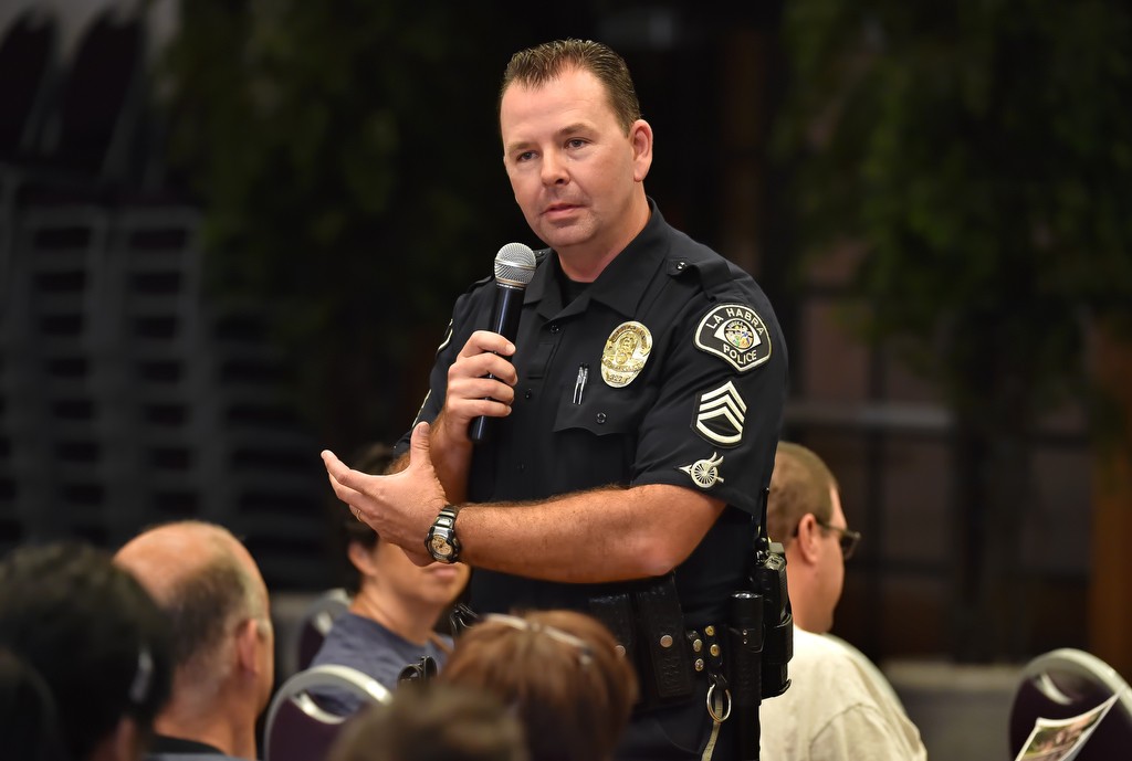 La Habra PD Sgt. Jim Tigner talks to attendees of a community meeting on emergency preparedness on how to survive an active shooter incident. Photo by Steven Georges/Behind the Badge OC