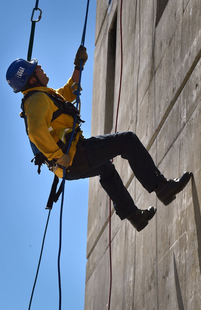 Urban Search and Rescue (USAR) Firefighter Francisco Baez of the Fullerton Fire Department rappels down the tower at North Net Fire Training Center in Anaheim during Fire Service Day 2016. Photo by Steven Georges/Behind the Badge OC