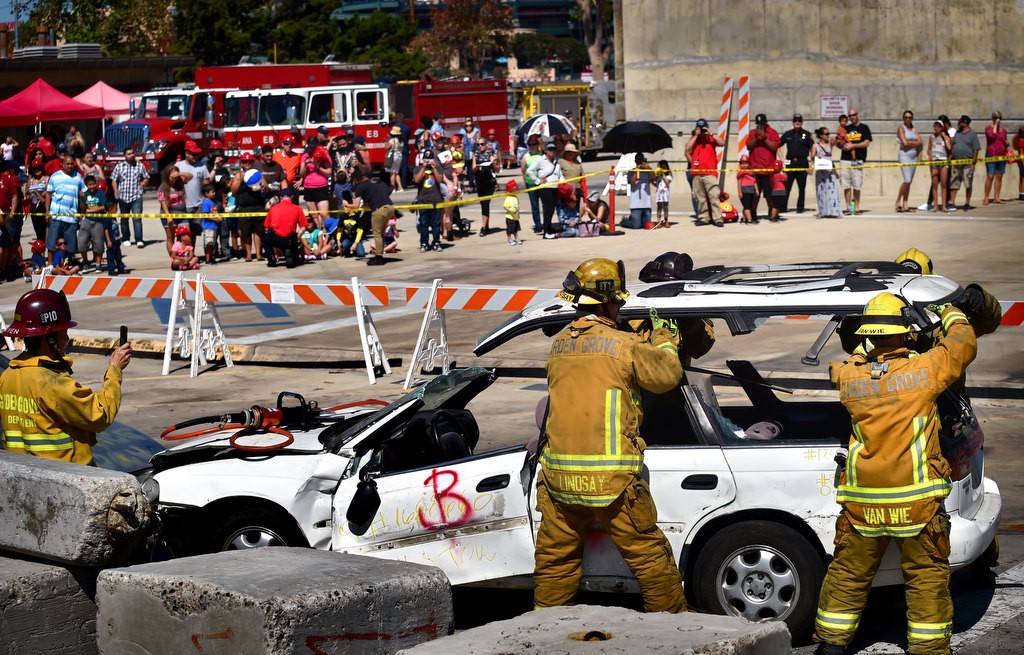 Garden Grove firefighters remove the top of a vehicle during a car rescue demonstration for Fire Service Day 2016 at the North Net Fire Training Center in Anaheim. Photo by Steven Georges/Behind the Badge OC