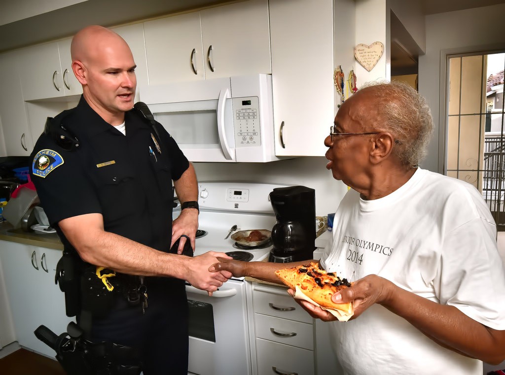 Anaheim PD Officer Brian Downs gets a thank you from Mae Hawthorne for the department’s consideration in her well being. Photo by Steven Georges/Behind the Badge OC