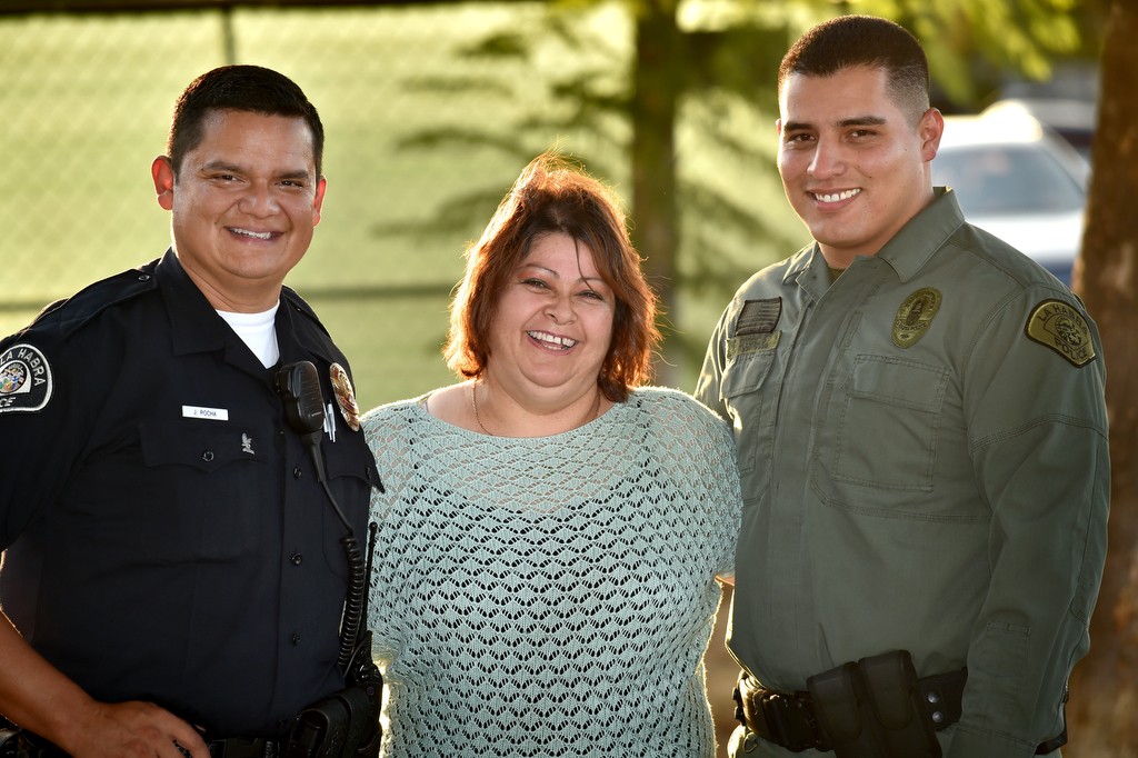 Norma Perez, center, a student in La Habra's Spanish speaking Citizens' Academy with La Habra Sgt. Jose Rocha, left, and Officer Ricardo Rodriguez. Photo by Steven Georges/Behind the Badge OC