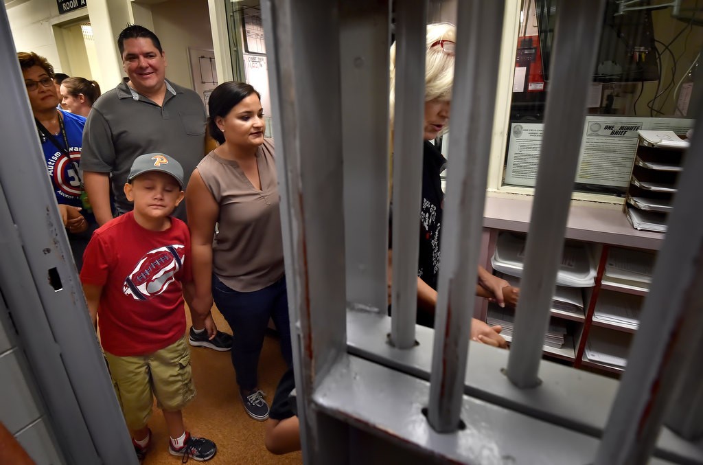 Autistic kids from Golden Hill Elementary School take a tour of the Fullerton Police jail promising center on the first floor during a tour of the station. Photo by Steven Georges/Behind the Badge OC