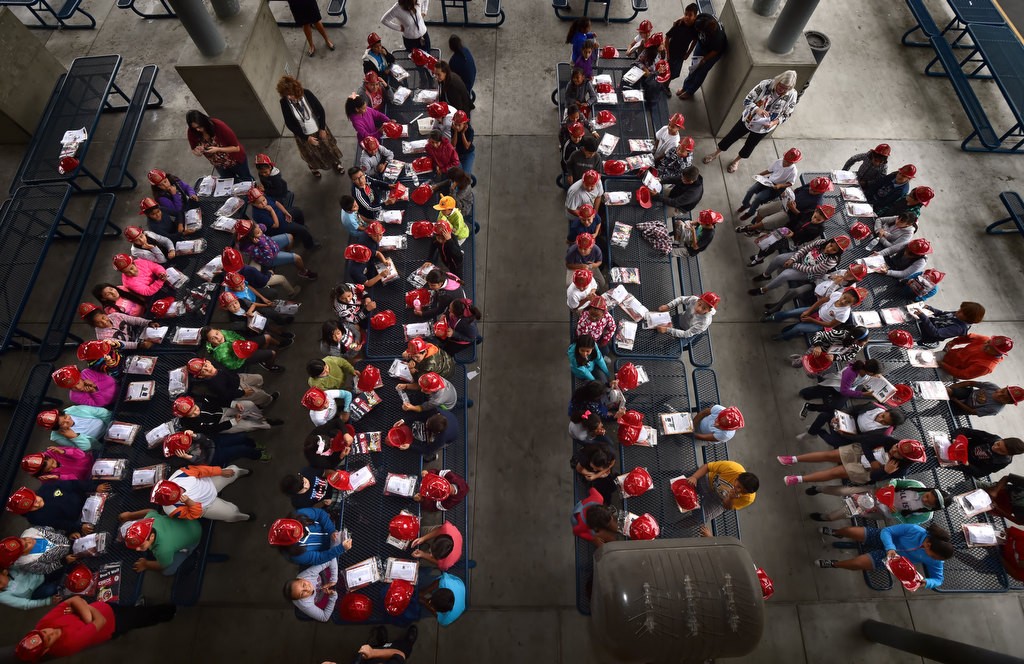 Students from Edison Elementary School receive free smoke alarms, fire prevention education packets and fire helmets as Anaheim Fire & Rescue visits the Anaheim school for Fire Prevention Week. Photo by Steven Georges/Behind the Badge OC