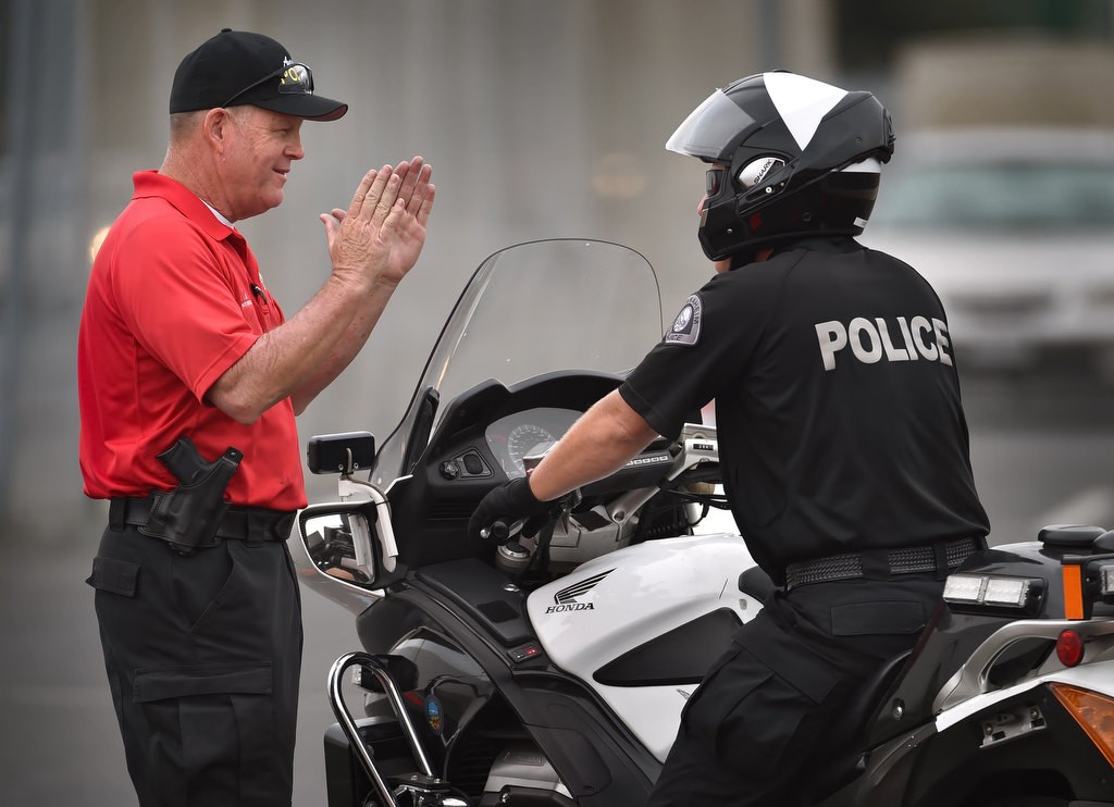 Anaheim PD Motor Instructor Doug Elms, left, gives advice to Anaheim Sgt. Rick Boyer on how to run through the Incline Pullout course during Anaheim PD’s motorcycle school. Photo by Steven Georges/Behind the Badge OC