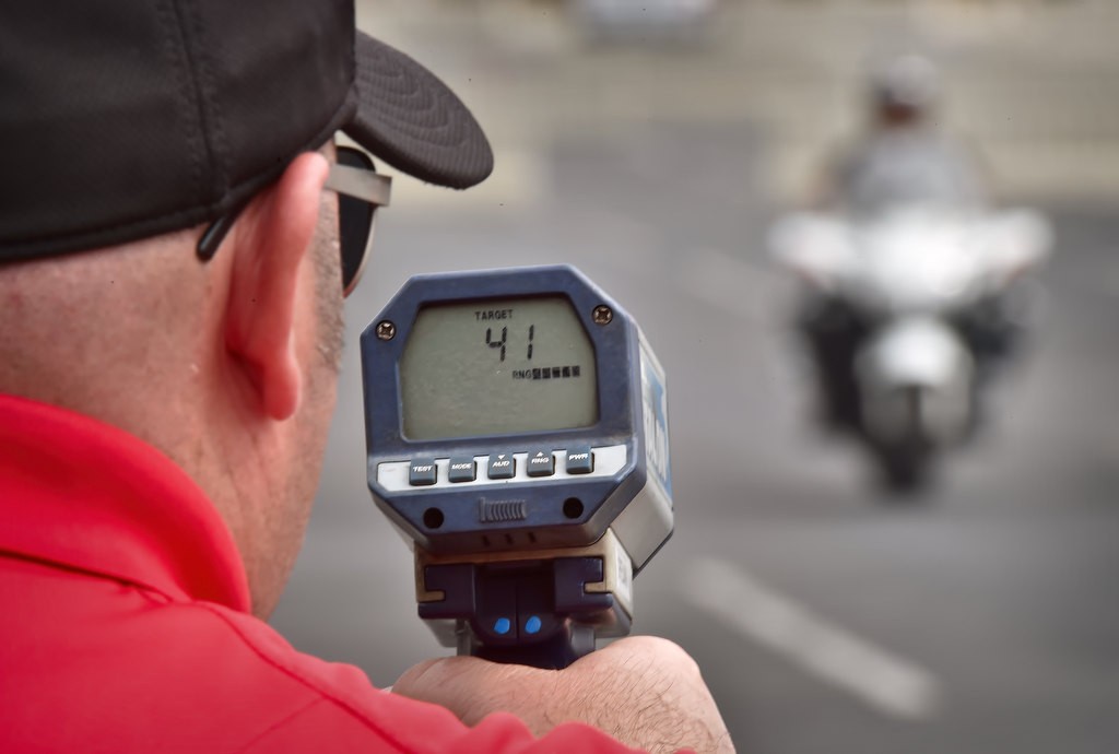 Anaheim PD Motor Instructor Shane Spielman makes sure motor students reach at least 40 mph before a sudden deceleration as they maneuver through cones for the “40 Decel” course. Photo by Steven Georges/Behind the Badge OC