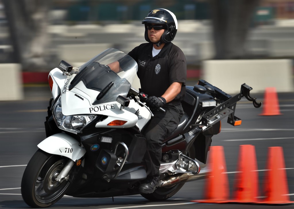 Anaheim PD Officer Mike Padilla makes his way through the 30 Cone Weave, part of Anaheim PD’s motor school. Photo by Steven Georges/Behind the Badge OC