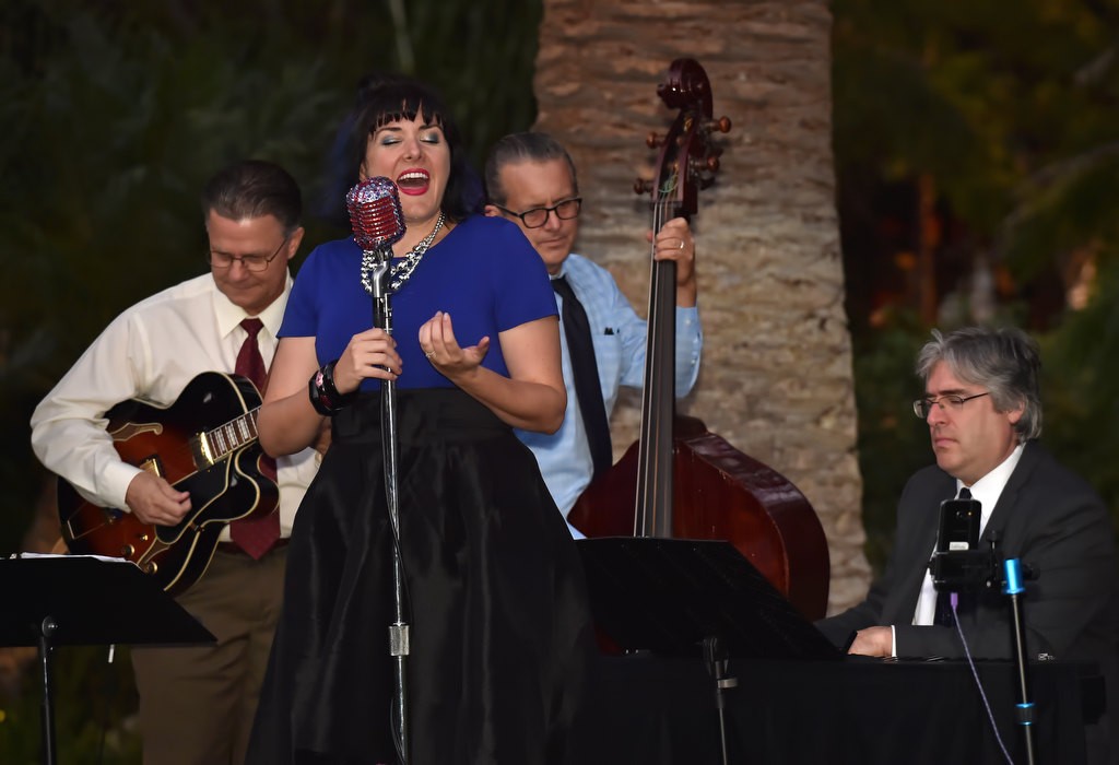 Molly Mahoney and Her Lucky Stars entertain guest with smooth jazz as they arrive for the Orange County Family Justice Center Foundation’s fundraiser. Accompanying Molly are Brad Roth on guitar, left, John Dominguez on bass and Chris Dawson on piano. Photo by Steven Georges/Behind the Badge OC