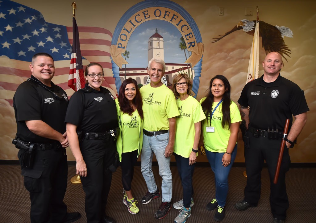 Fullerton PD Homeless Liaisons and volunteers from the Coast to Coast Foundation gather at the Fullerton PD before heading out to the streets to find people in need of help. From left is Cpl. Jim Talbot, Cpl. Ginny Johnson, Coast to Coast founder Marie Avena, Dave Rhode, Claudia Hamano, Jazmine Quijano and Cpl. Dan Heying. Photo by Steven Georges/Behind the Badge OC