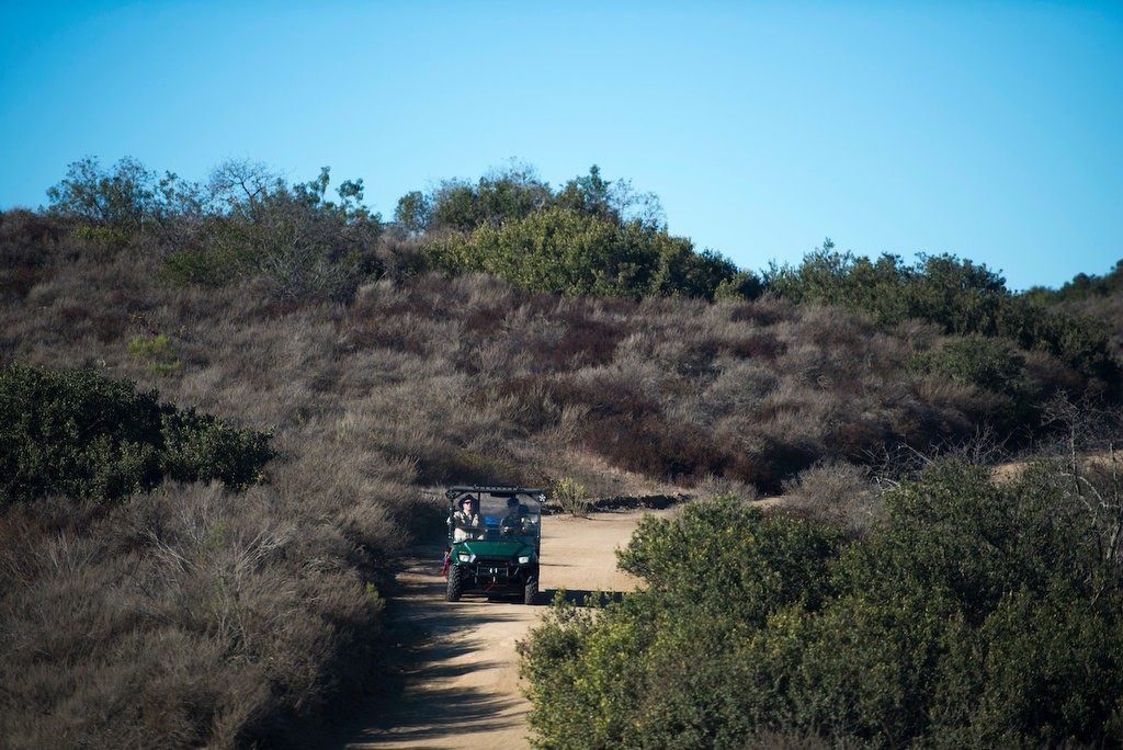 Members of the Orange County Sheriff's Search and Rescue Team ride a fire trail down in a Polaris off-road vehicle as they demonstrate the process of finding a lost subject in the Aliso Woods Wilderness Park.  The Polaris allow for a fast search over steep terrain in a search.