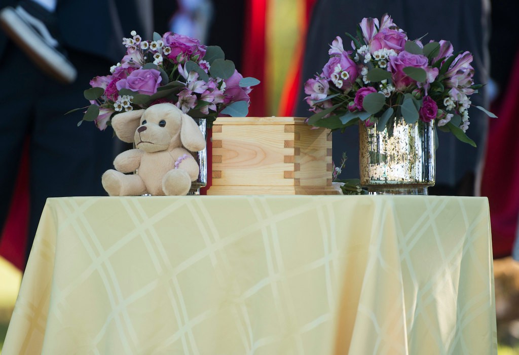 The remains of baby Kathleen, an unidentified infant, are presented  during her memorial service before being buried in the Garden of Innocence at the El Toro Memorial Park Cemetery.