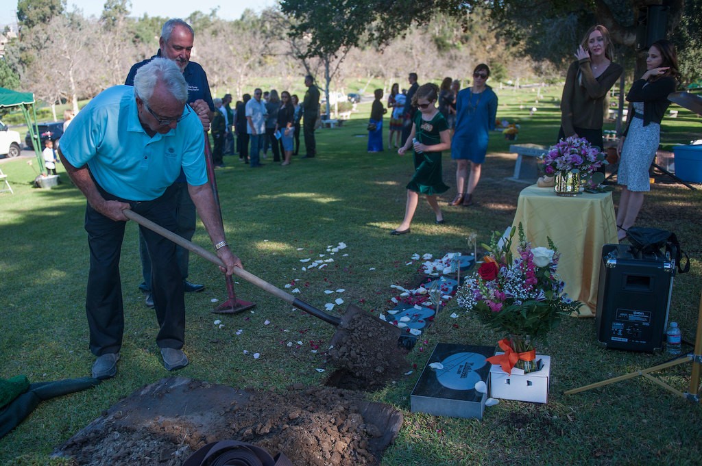 Norman Scott places dirt in the grave of Kathleen, an unidentified infant who was provided with a name, memorial service and burial through the Orange County Garden of Innocence project.  Scott named the baby and kept her remains on his mate for two months before Saturday's memorial service. Norman Scott places dirt in the grave of Kathleen, an unidentified infant who was provided with a name, memorial service and burial through the Orange County Garden of Innocence project.  Scott named the baby and kept her remains on his mate for two months before Saturday's memorial service. Norman Scott places dirt in the grave of Kathleen, an unidentified infant who was provided with a name, memorial service and burial through the Orange County Garden of Innocence project.  Scott named the baby and kept her remains on his mate for two months before Saturday's memorial service. Photo by Miguel Vasconcellos