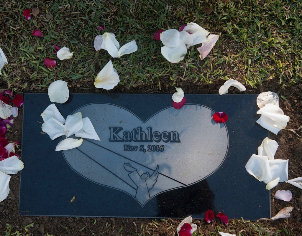 The marker for baby Kathleen, an unidentified infant who was given a name and memorial service through the Garden of Innocence program at the El Toro Memorial Park Cemetery Saturday. Photo by Miguel Vasconcellos