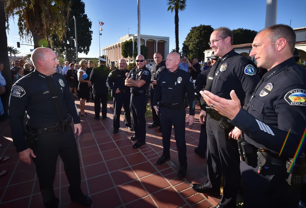 Fullerton Police Chief Dan Hughes, left, is greeted by police chiefs Tom Kisela of Orange PD, Corey Sianez of Buena Park PD, Raul Quezada of Anaheim PD, George Crum of Cathedral City PD (former Fullerton PD Captain), Mark Hamilton of Irvine PD and Charles Celano of Tustin PD, right, during the Walk of Honor retirement ceremony at Fullerton PD. Photo by Steven Georges/Behind the Badge OC