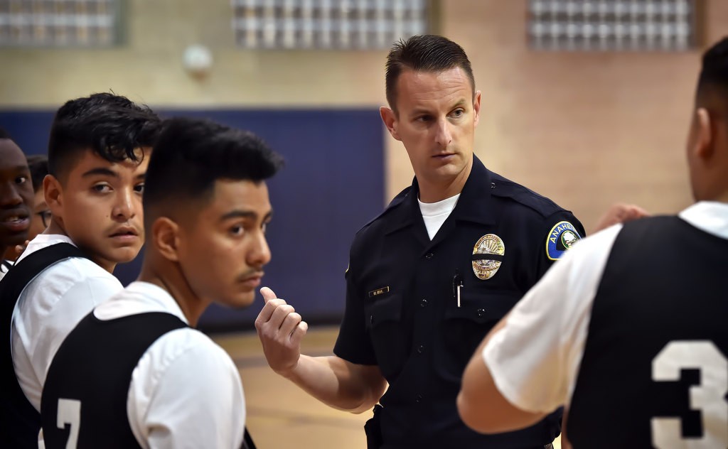 Anaheim Police Officer Mark Gell coaches his team during basketball game at the West Anaheim Youth Center. Photo by Steven Georges/Behind the Badge OC