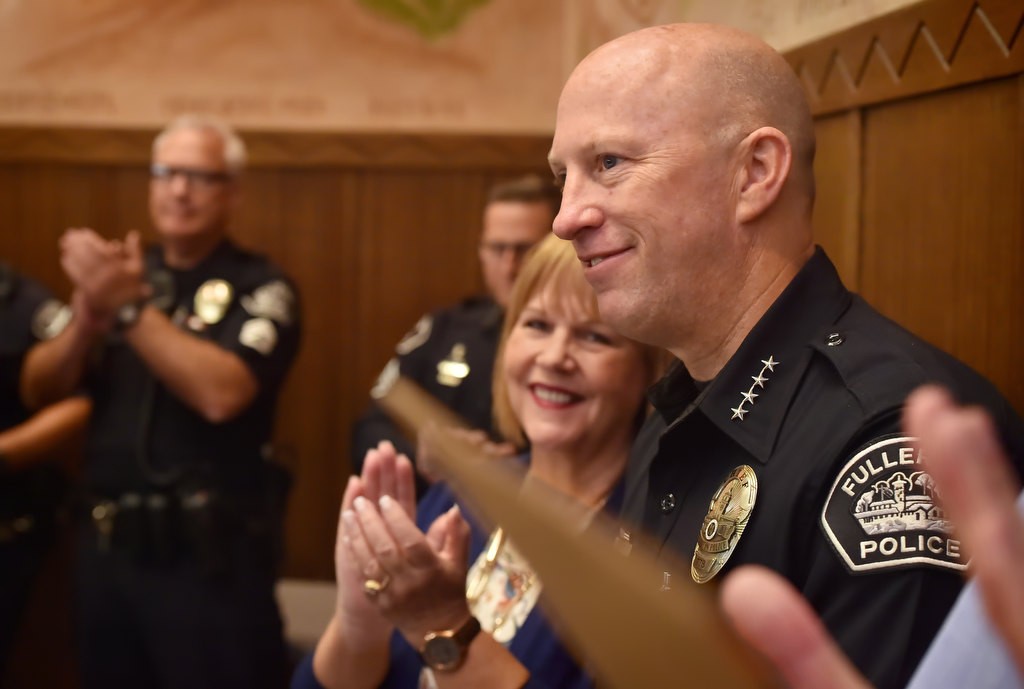 Fullerton PD Chief Dan Hughes smiles as he receives a surprise honor from the OC GRIP. (Gang Reduction Intervention Partnership) during a GRIP meeting at Fullerton Police headquarters. Photo by Steven Georges/Behind the Badge OC