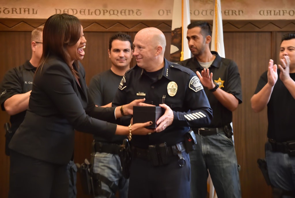 Tamika Williams, a deputy district attorney for Orange County, honors Fullerton PD Chief Dan Hughes with a surprise award an OC GRIP meeting. Photo by Steven Georges/Behind the Badge OC