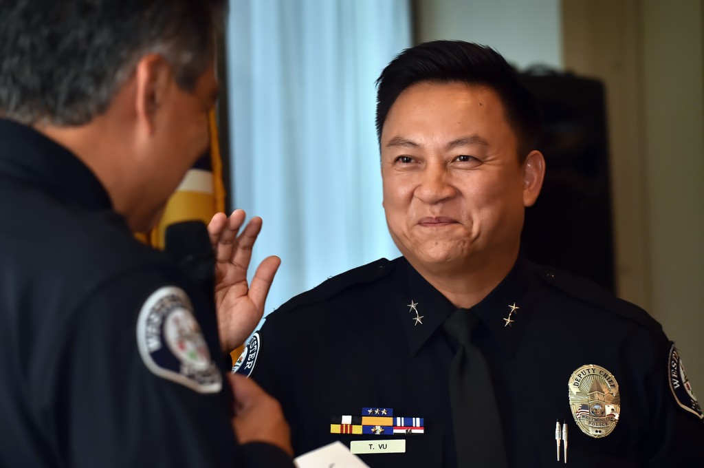 Westminster PD Interim Chief Roy Campos, left, swears in Timothy Vu as the department’s new Deputy Chief during a ceremony in Westminster. Photo by Steven Georges/Behind the Badge OC
