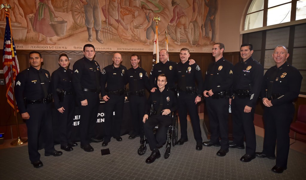 Los Angeles Fullerton police officers gather to honor three FPD officers, Officer Timothy Gibert, Cpl. Matt Wilkerson and Officer Michael Halverson, who helped save the life of LAPD Officer Nick Wiltz, center in wheelchair, back in August after an off duty motorcycle accident in Fullerton. Photo by Steven Georges/Behind the Badge OC