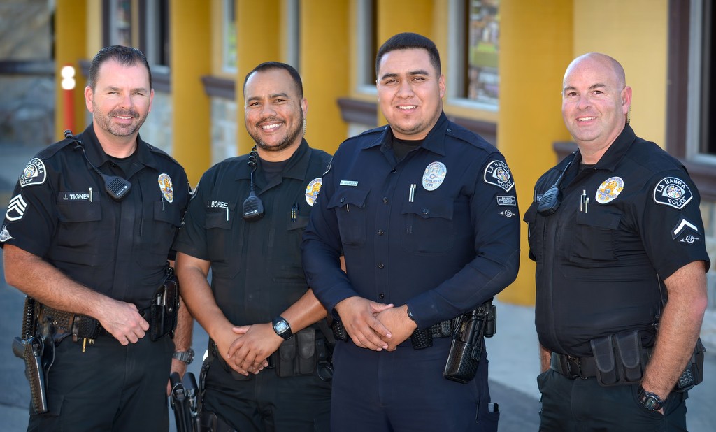 The La Habra PD handicap parking team from left, Sgt. Jim Tigner, Officer Sumner Bohee, Parking Enforcement Officer M. Velasquez and Officer Jason Coleman. Photo by Steven Georges/Behind the Badge OC