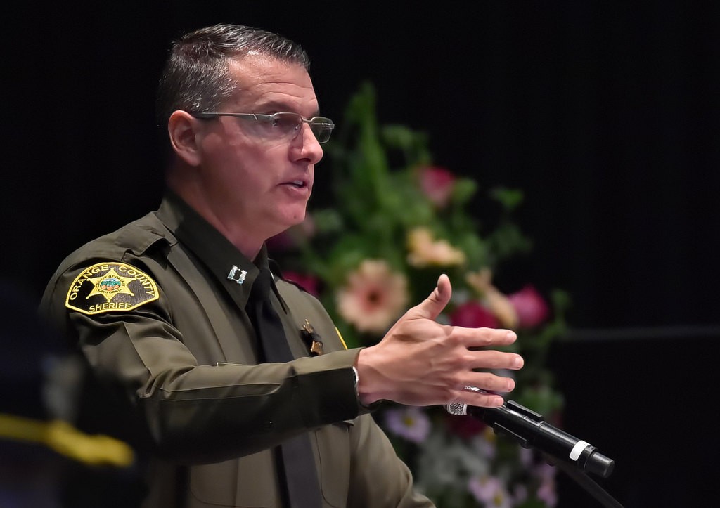 OC Sheriff Captain Jason Park talks about Deputy Courtney Ward’s strength, determination, and her battle with cancer during a memorial service for her at Crossline Community Church. Photo by Steven Georges/Behind the Badge OC