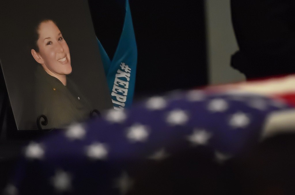 A photograph of Orange County Sheriff Deputy Courtney Ward is displayed next to her flag draped casket during her memorial service at Crossline Community Church in Laguna Hills. Photo by Steven Georges/Behind the Badge OC