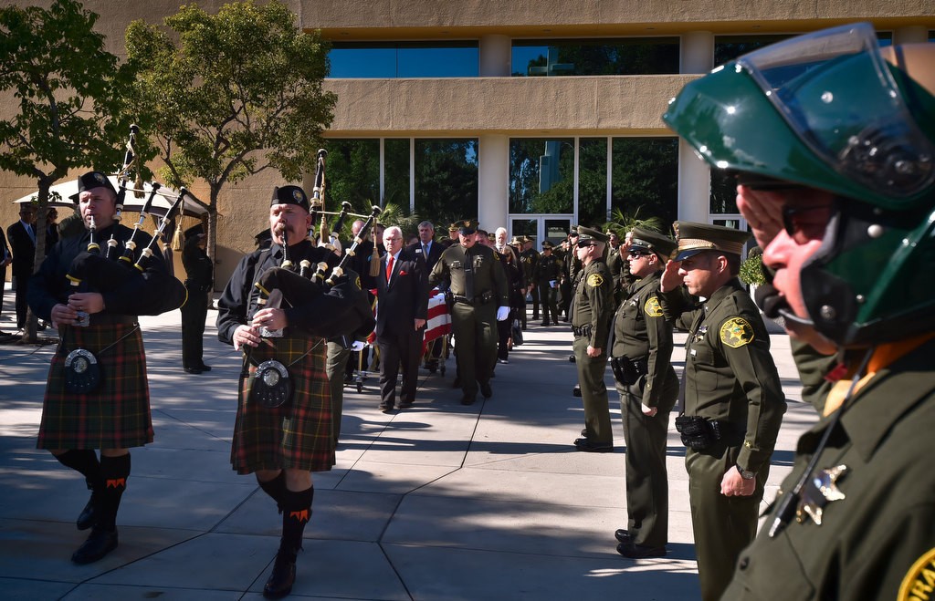 Bagpipe players from the OCSD play in front of Deputy Courtney Ward’s casket as it is carried away from Crossline Community Church in Laguna Niguel. Photo by Steven Georges/Behind the Badge OC
