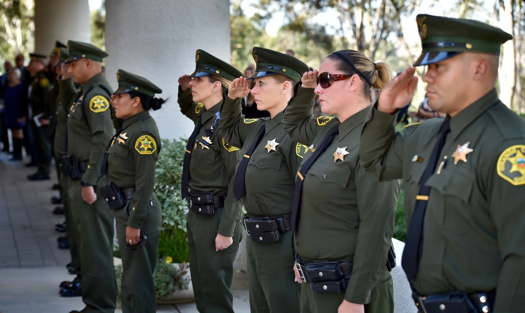 OCD deputies salute as the casket of Deputy Courtney Ward is carried past them at the conclusion of funeral services at Crossline Community Church. Photo by Steven Georges/Behind the Badge OC