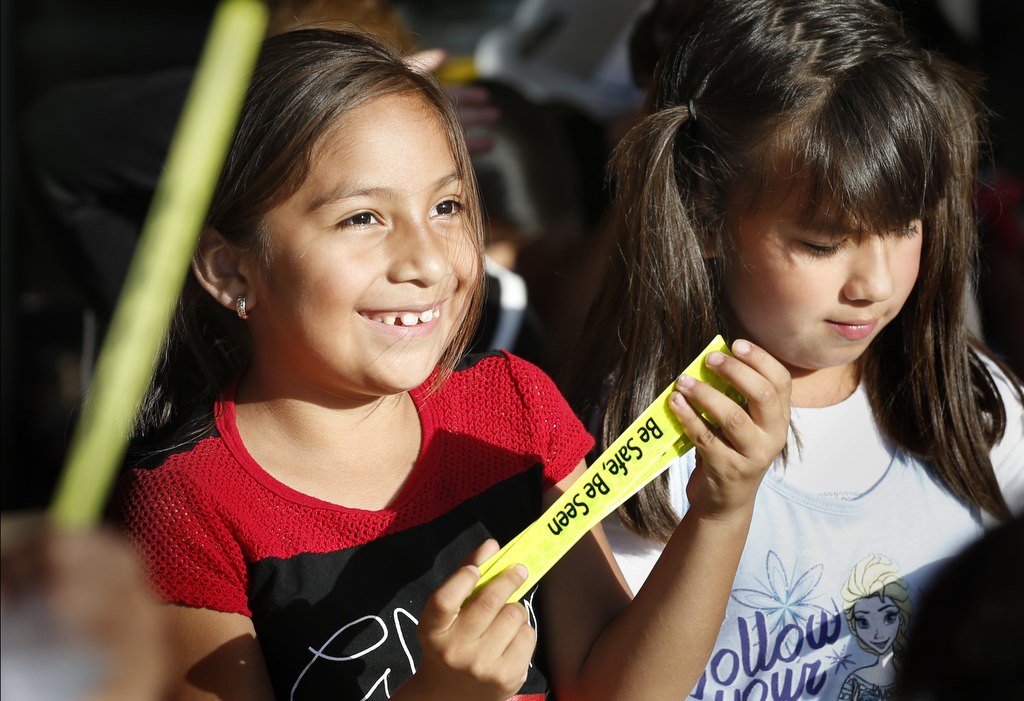Elementary school students received "Be Safe, Be Seen" wrist bands from the OCSD during a bike safety program. Photo by Christine Cotter